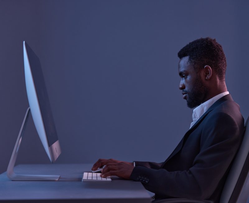 man online lifestyle freelancer technology night work business young american african keyboard